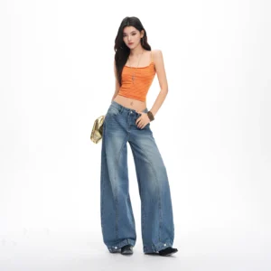 washed distressed loose-fitting jeans for women with buttoned edges, curved three-dimensional cut, and wide-leg design. 1
